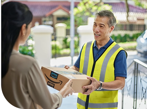 Delivery man delivery Amazon package to a woman