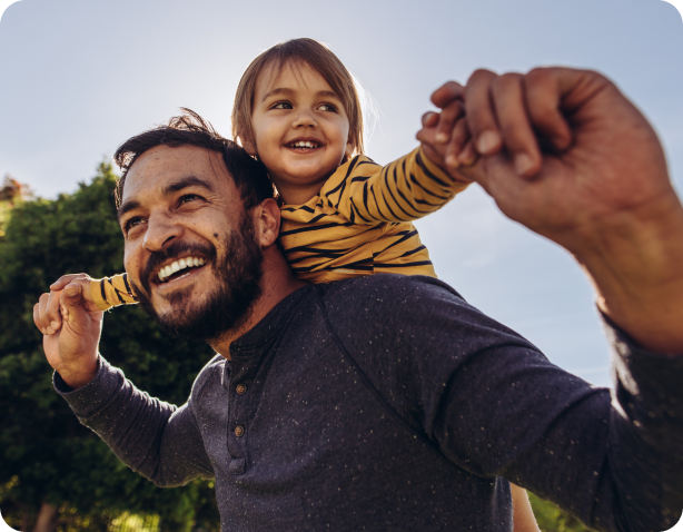 Energized dad holding kid on his back