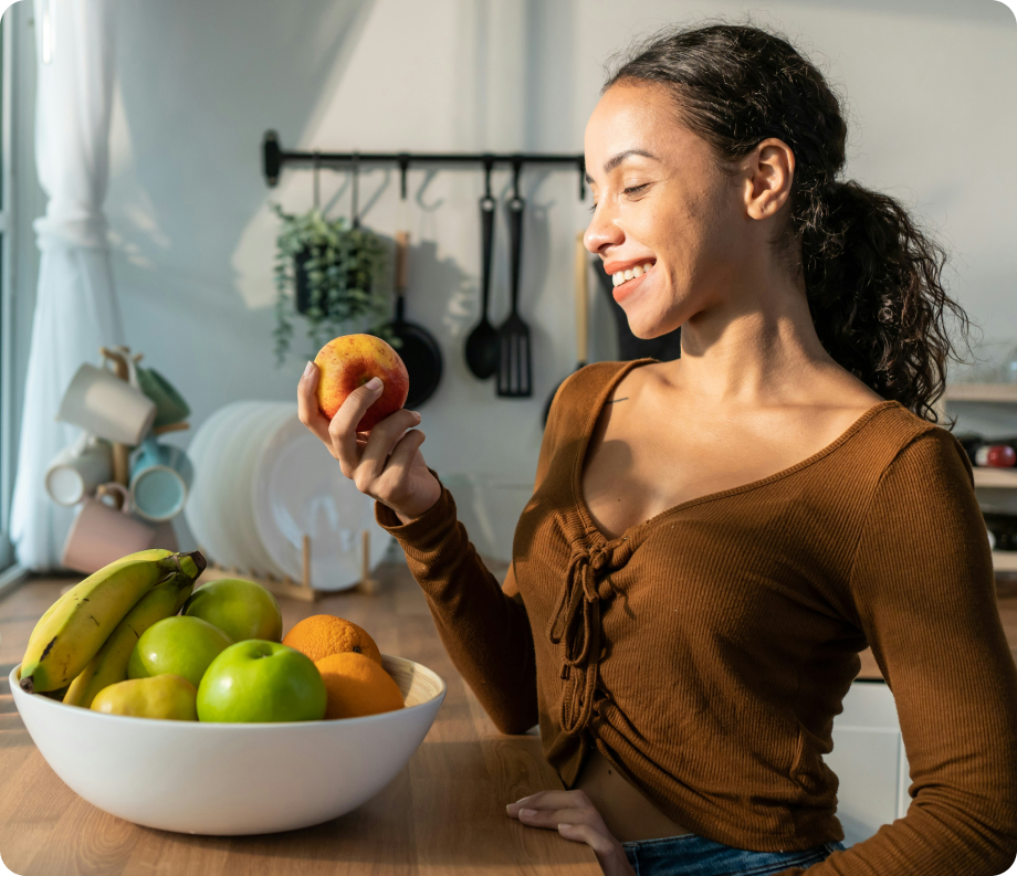 Woman looking at an apple
