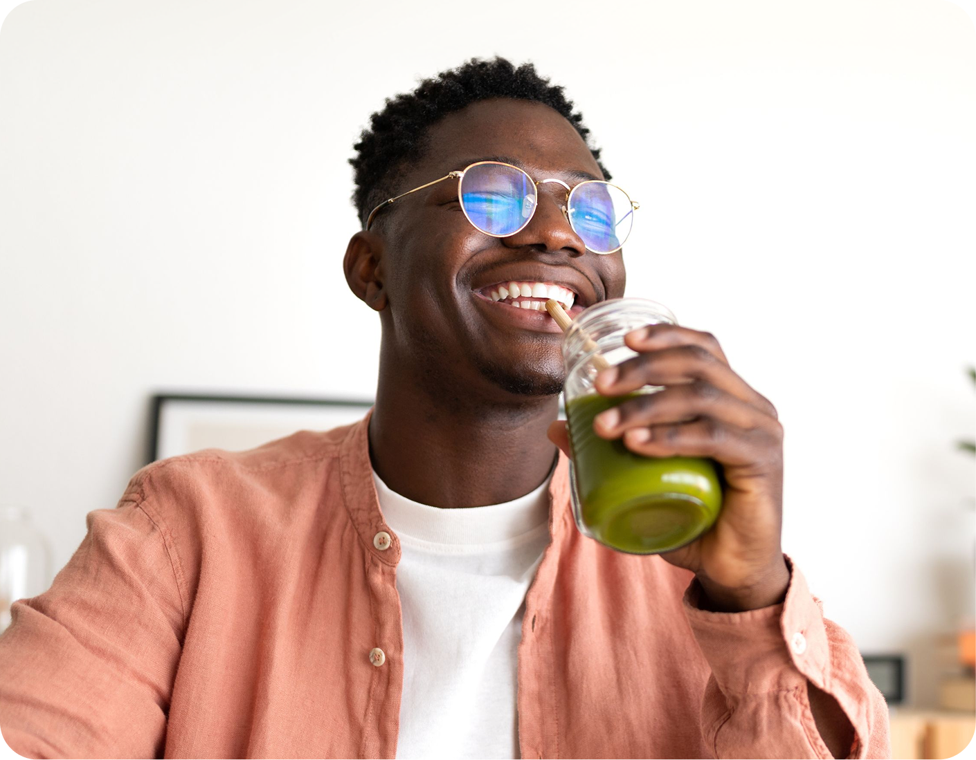 Man drinking green juice