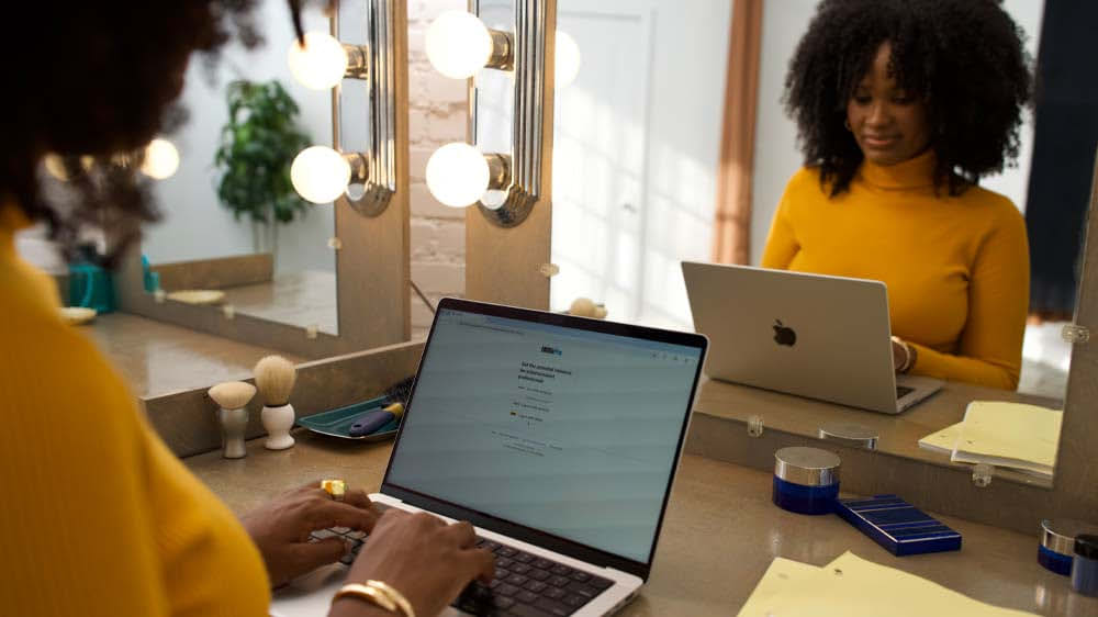 IMDbPro image of a person in the entertainment industry on their computer updating their IMDbPro account.