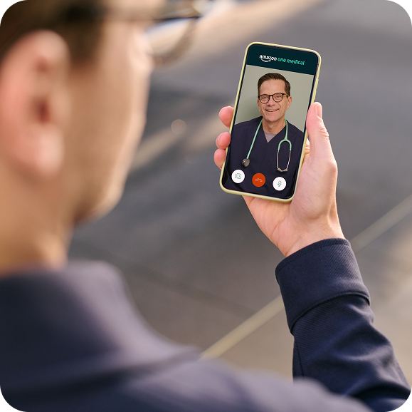 Man talks to online doctor on his phone through On-Demand Care