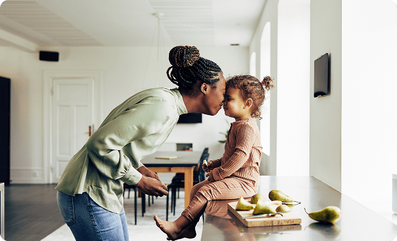 Mom plays with her sick child after getting virtual care from Amazon One Medical