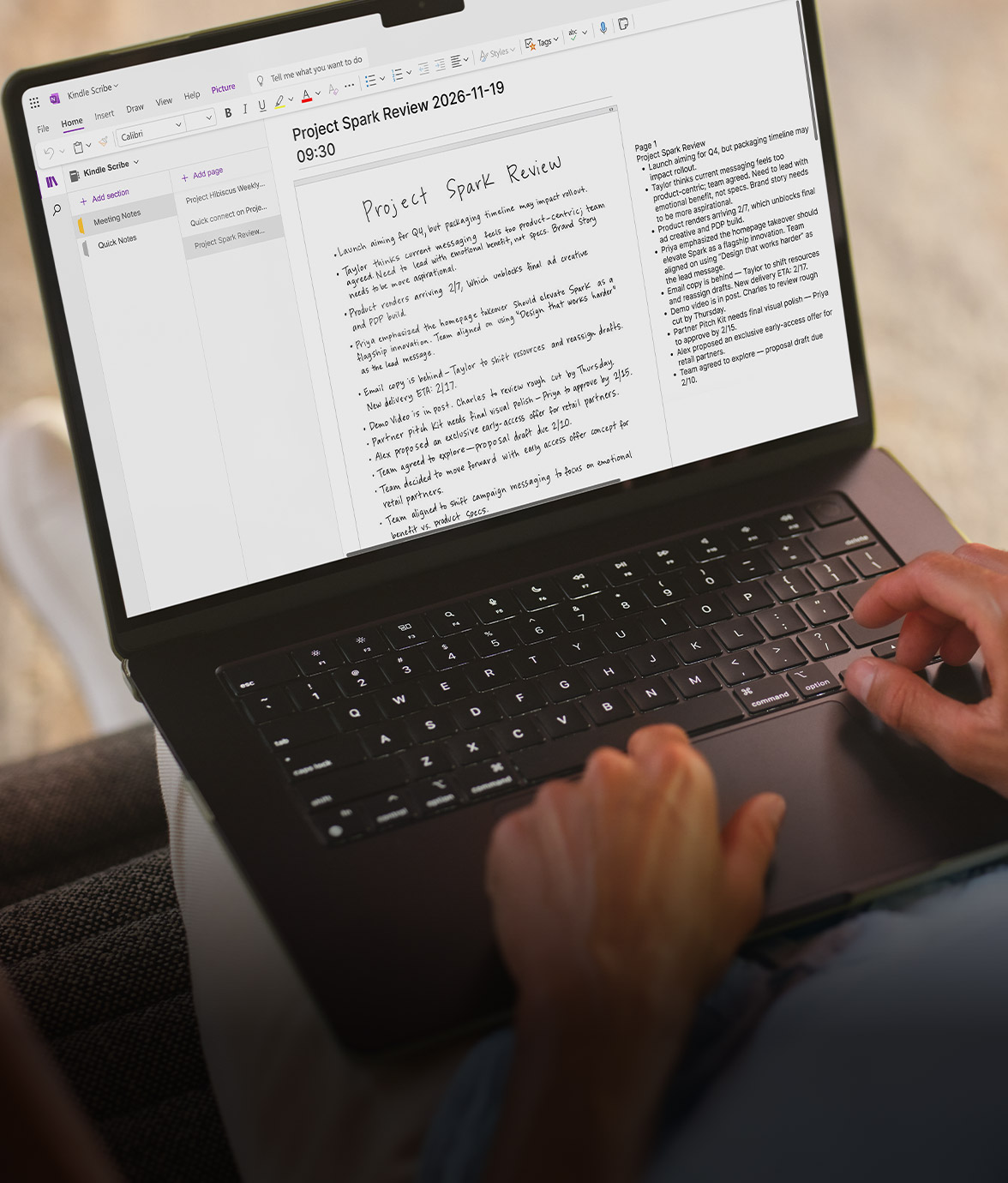 A laptop screen displaying handwritten notes synced from Kindle Scribe alongside their converted typed version in a note-taking app, while someone types on the keyboard.
