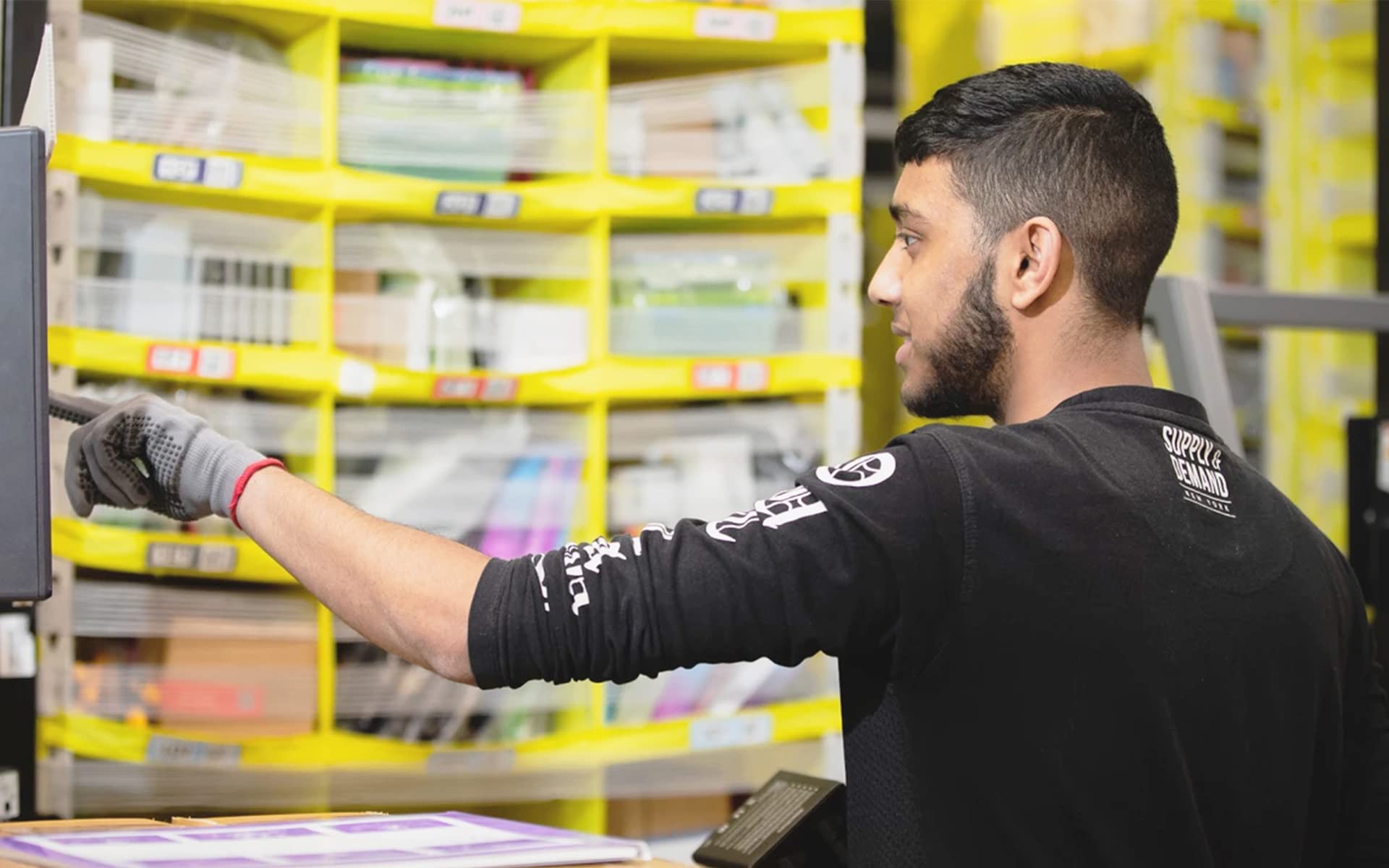 An Amazon employee sorting products.