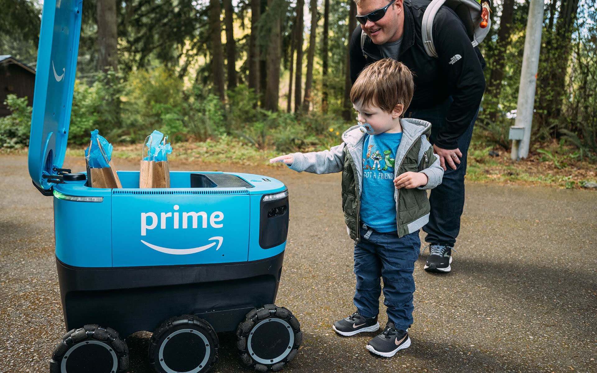 A young boy playing with a Scout device.