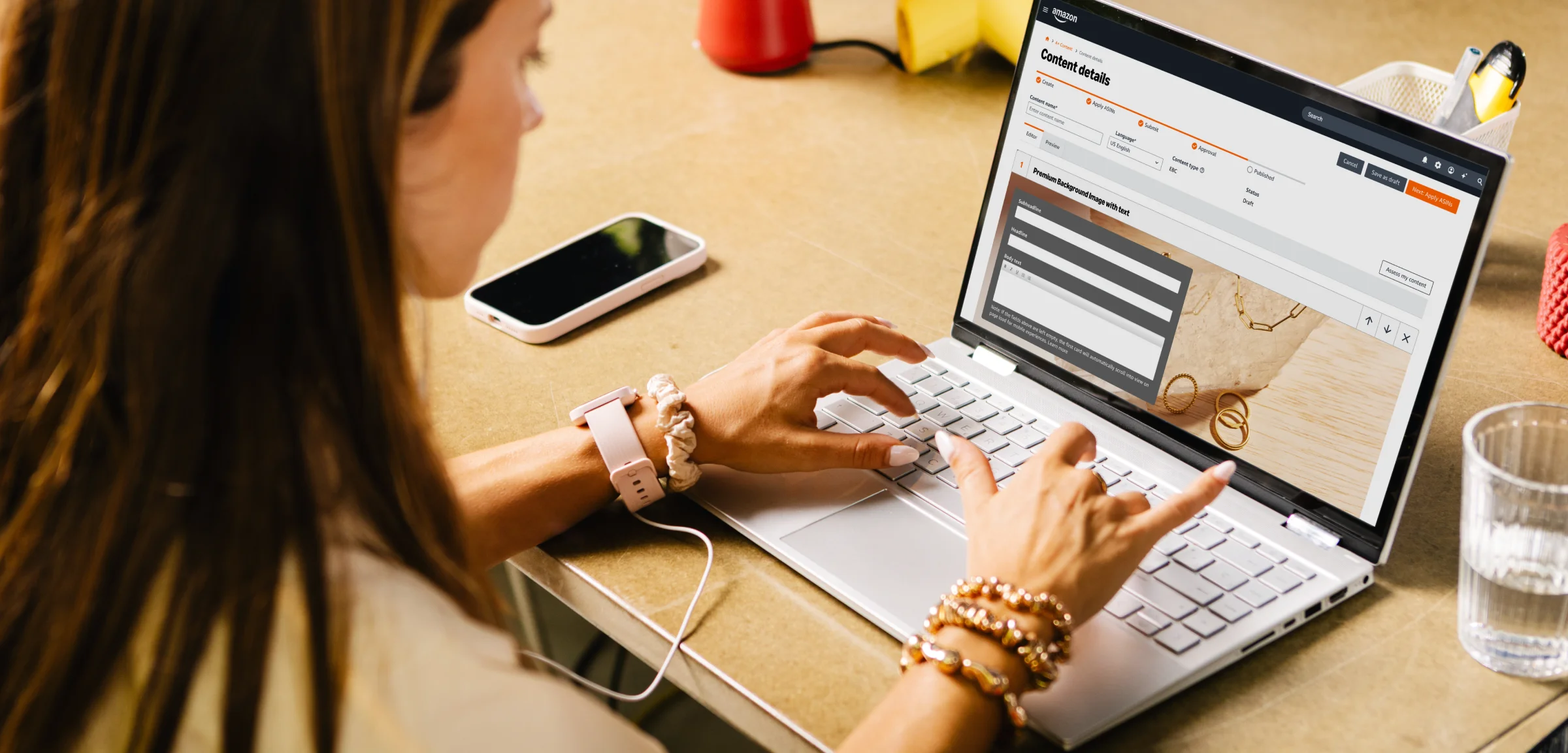 A person uses a laptop displaying a content details page for editing on Amazon Seller Central