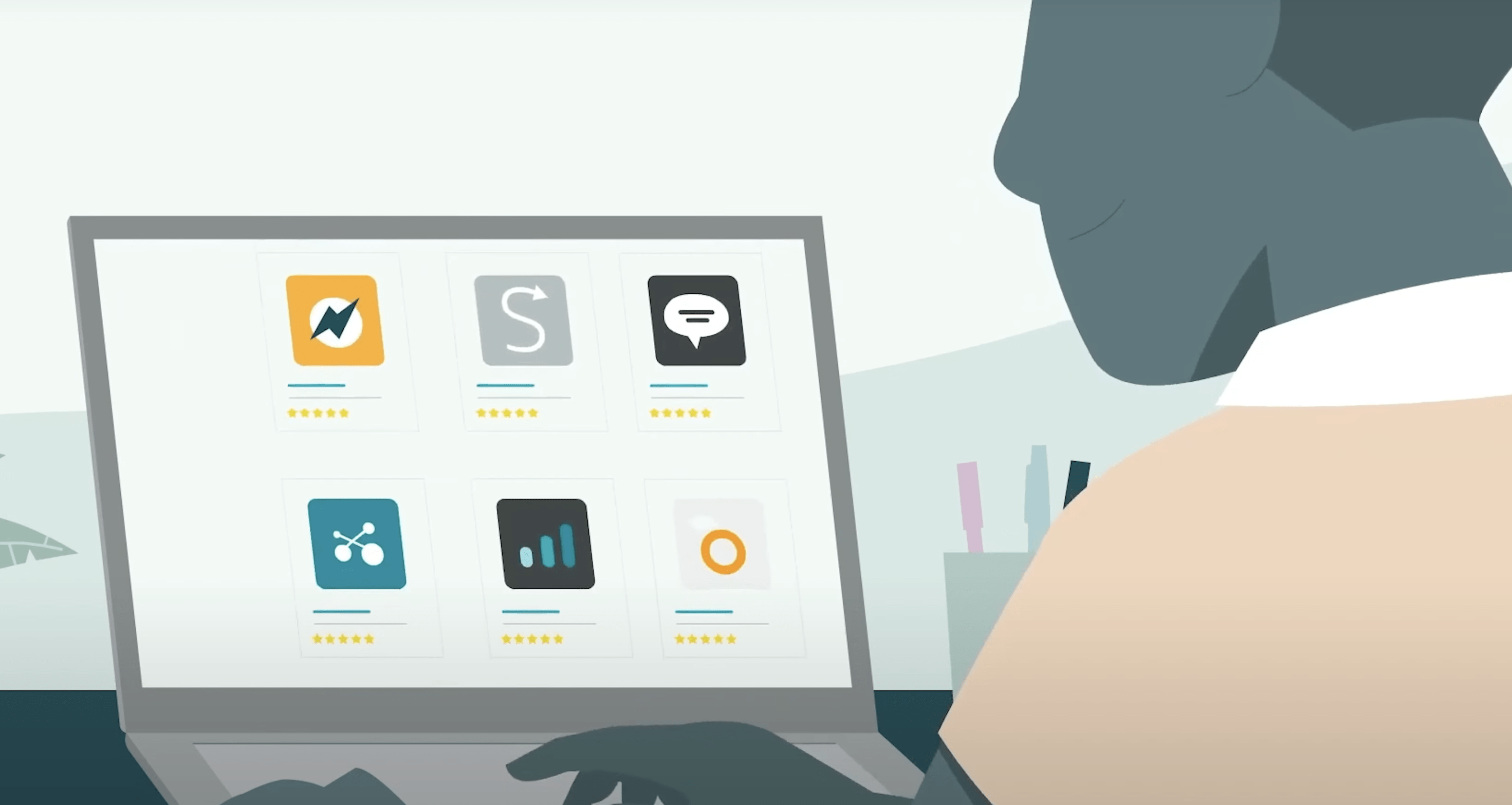 Man sitting at a computer with apps floating around his head