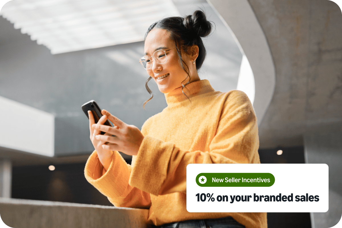 Business owner posing with products in a kitchen