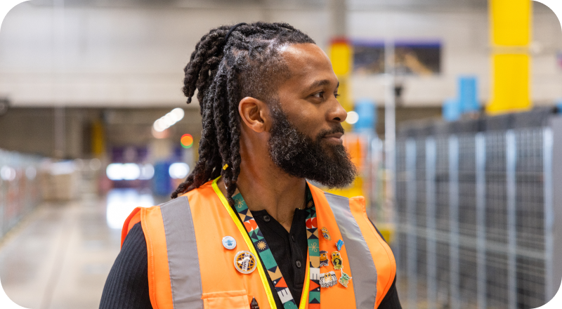 Warehouse Associate wearing safety vest in Amazon fulfillment center