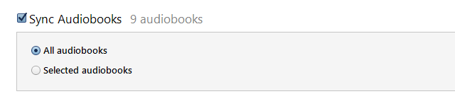 How can I automatically transfer Audible content to my Apple device?