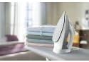 Philips 5000 Series DST5010/10 Steam Iron resting on an ironing board
