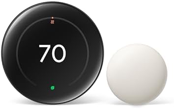 Google Nest Learning Thermostat 4th Generation in obsidian finish mounted on a modern white wall, the curved 2.7-inch glass display showing the current temperature with the iconic rotating outer ring catching soft window light, the included 2nd-gen Temperature Sensor visible as a small puck on a nearby shelf — Wirecutter's 'smartest thermostat' for 2026 with the new Suggestions learning mode.