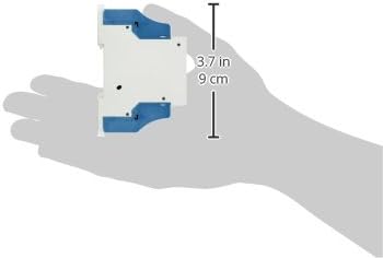 lateral view of the Eltako R12-100-24VDC relay held in a hand, showing its compact dimensions of 3.7 inches (9 cm) in height.