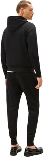 Close-up of the Tommy Hilfiger flag logo on the tracksuit.