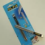 Cortador de metal Olfa para láminas y rótulos y adhesivos de pared.