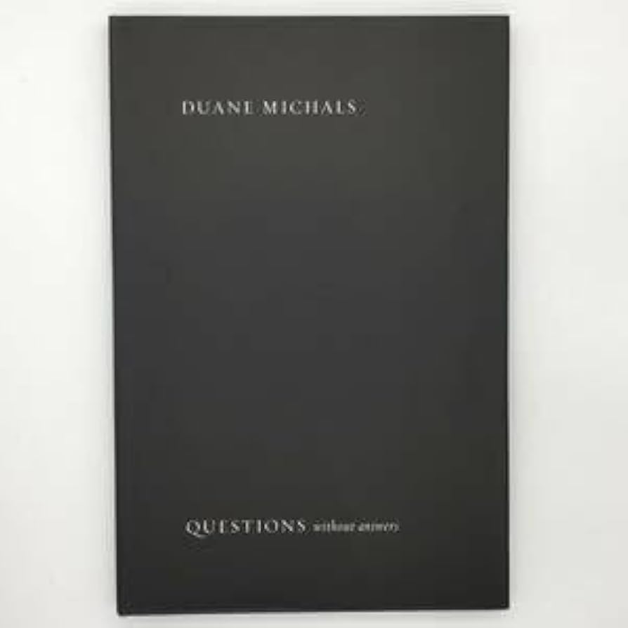 Amazon.co.jp: 写真集Questions without Answers：デュアン