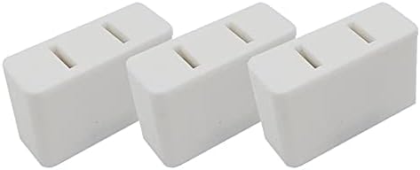 Three white rectangular wall adapters