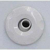 Close-up of a white circular drain cover or jet component with a dark central opening.