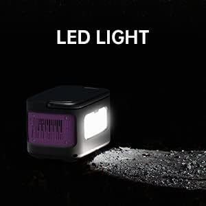 The imuto Portable Power Station with its LED light illuminated in a dark environment.
