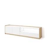 Module TV avec portes battantes et grande capacité de rangement. Charnières avec fermeture soft. Dimensions du module : 104 cm de largeur, 50 cm de hauteur, 37 cm de profondeur. Couleur blanc mat et chêne clair avec veinures en bois poreux de haute qualité.