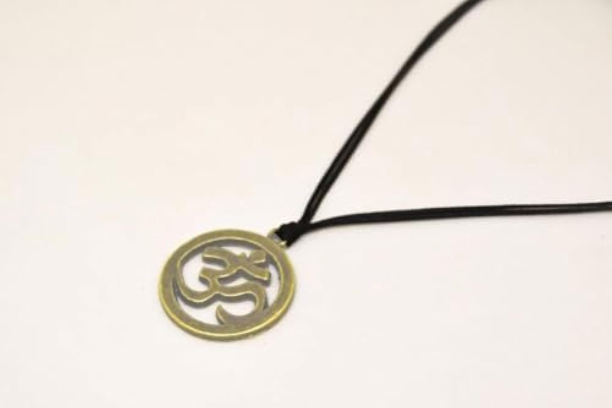 Unisex Adjustable Golden Om Locket Pendant on Black Thread