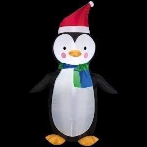 Home Accents Holiday Lighted Inflatable Penguin with blue and green scarf and Santa hat