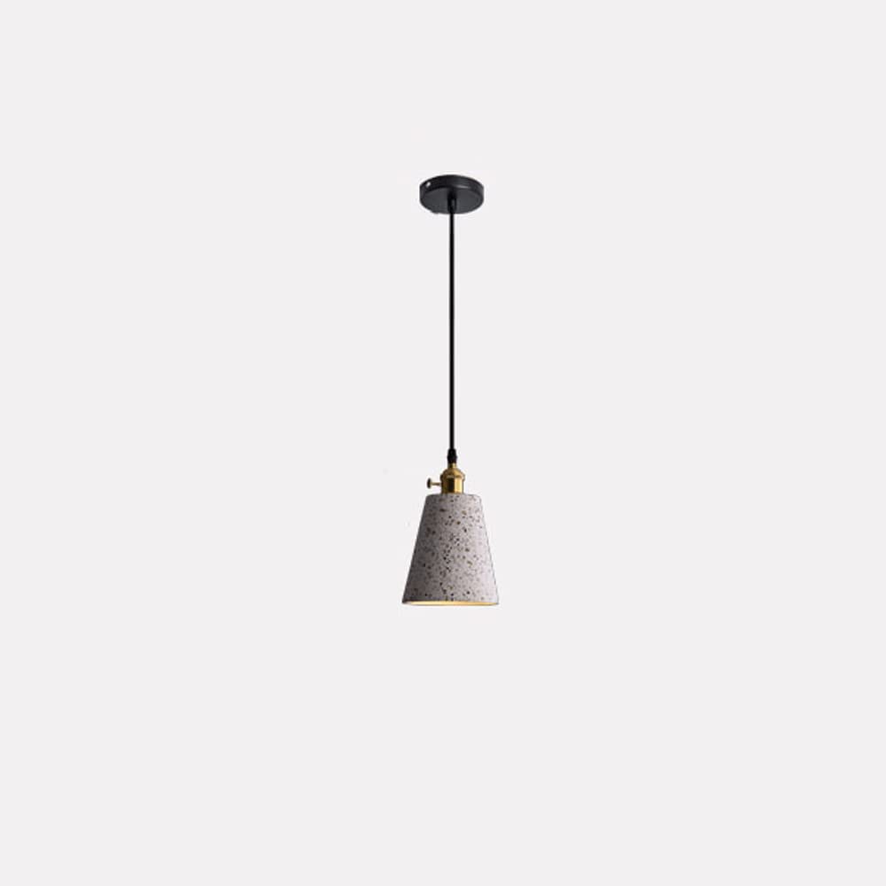 Lampe suspendue terrazzo rose créant une ambiance douce dans la chambre