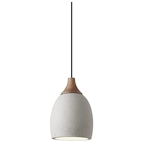 Lampe suspendue en ciment pour sublimer un éclairage de restaurant sombre moderne