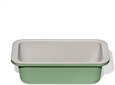 Light-coloured ceramic coated loaf pan with rounded inside corners and wide flat rim handles