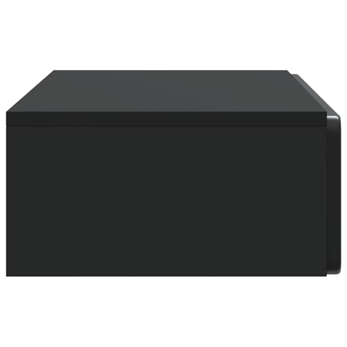 Mesa de pared de madera con cajón negro que optimiza espacio en salones modernos 7