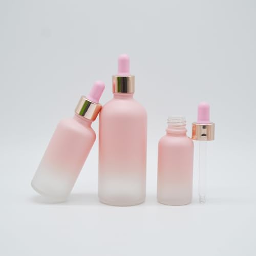 Flacon compte-gouttes en verre rose givré et bague or raffinée 100ml