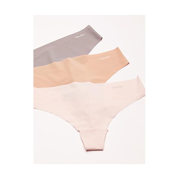 Calvin Klein Women's Invisibles Seamless Thong Panties, 7 Pack, Black/White/Bare/Silverlock/Undertone/Subtle Bloom/Speakeasy, Small