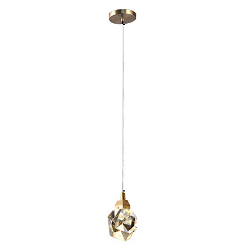 Lustre en cuivre et cristal pour créer un cocon lumineux au salon