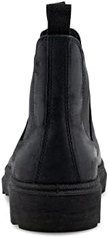 Stylish man confidently wearing ECCO Grainer M Chelsea boots with a refined casual ensemble.