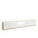Module TV avec niche et porte battante. Charnières avec fermeture soft. Dimensions du module: 104 cm. de largeur, 50 cm. de hauteur, 37 cm. de profondeur. Couleur blanc et chêne clair avec veinures en bois poreux de haute qualité.