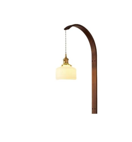 Aplique de pared wabi-sabi en madera de nogal y cobre para crear un dormitorio acogedor
