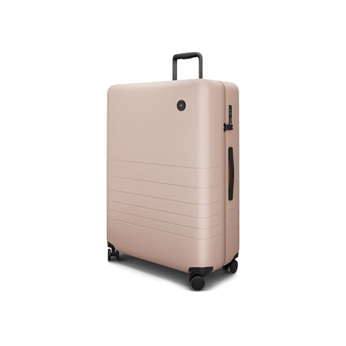 Monos Large Checked Luggage 29 Inch – Lightweight Hardside Spinner Suitcase with TSA Lock | 97.3L Polycarbonate Rolling Check-In Bag for 7–21 Day Trips | Includes Laundry & Shoe Bags | Rose Quartz