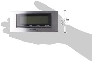 Image of the Technoline WT 182 alarm clock held in a hand, illustrating its compact size.