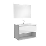 Tirador tipo uñero integrado en el frente del mueble aunando funcionalidad y diseño.