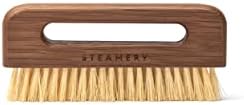 Vegan pocket-sized clothing brush from Steamery. Removes lint and fuzz.