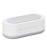 . Máquina de limpieza , limpia joyas sucias en usando , el deslustre.