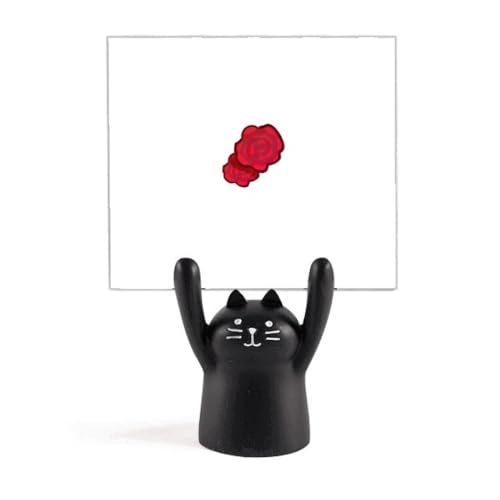 Support mémo chat noir sur un bureau fleuri pour ranger vos notes