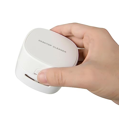 A fully working, palm-sized desktop vacuum that actually sucks up crumbs — novelty meets genuine desk utility.