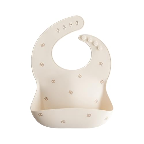 Image of mushie Silicone Baby Bib | Adjustable Fit Waterproof Bibs (Pretzel)