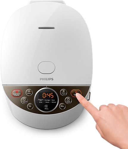Pressing the Start button on the Philips rice cooker