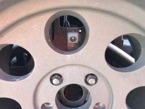Intern view of backup camera mounted within a wheel spoke
