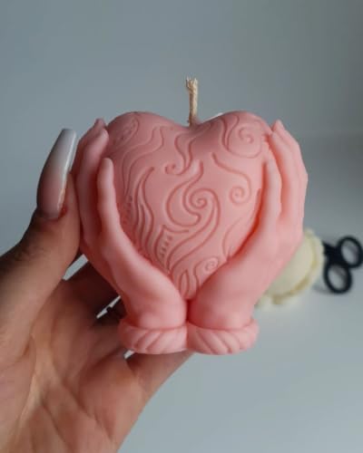 Image of Heart Held in Hands Sculpted Candle Pink | Decorative Sculpture, Swirl Embossed Design
