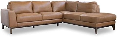 Close-up of the tan leather upholstery and wooden legs of the ASHCROFT Milton Sectional Sofa