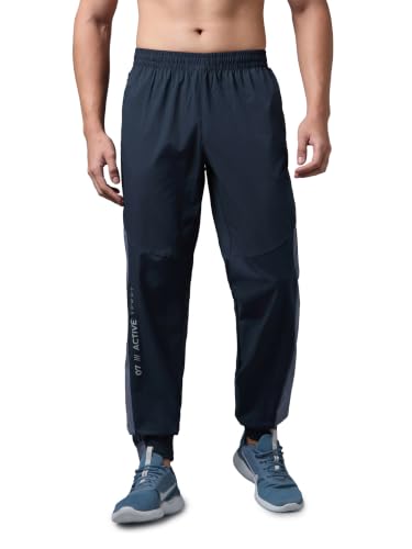 Image of TECHNOSPORT Men's Regular Fit Joggers with Zip Pockets, TECHNOLITE Quick Dry Stretchable Lightweight Track Pants for Gym Running and Casual Wear